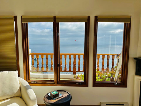 - Let the view be your backdrop, three large windows frame the endless horizon
- Ocean watching from the comfort of a cozy reading chair or fireside spot
- Catch boats and parasails drifting by without leaving the living room