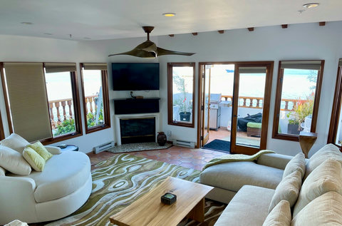 - Bask in natural light and jaw dropping ocean views from this chic, sun soaked lounge
- Snuggle up by the designer fireplace or binge your favorite shows on the flat screen TV
- Open the doors to a breezy BBQ patio just steps away