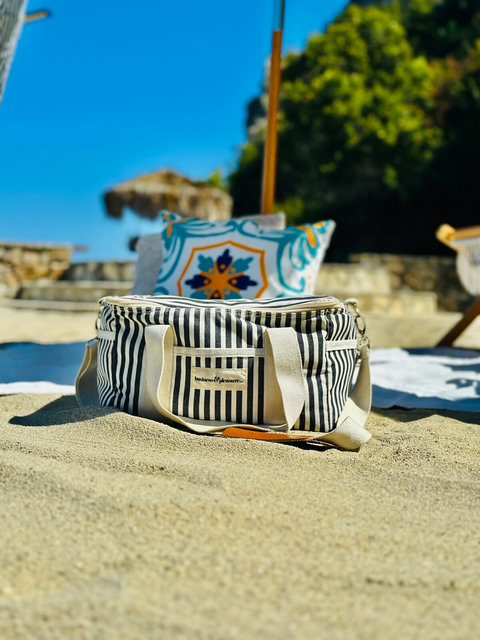 Stylish and beach ready, this striped cooler bag is your go-to for a perfect day by the waves.