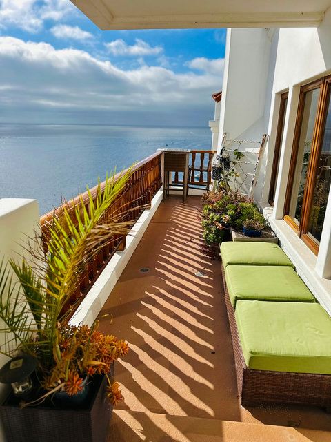 - Start your day with coffee and sunshine on this peaceful coastal view balcony
- Lounge comfortably among greenery, cushioned seating, and tranquil sea breezes
- From sunrise to stargazing, this space is your front row seat to the Pacific