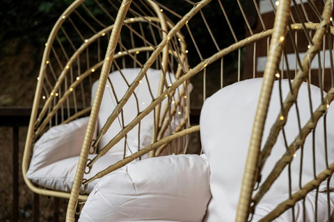 Front porch egg chairs feel like a dream and  light up to make it even more whimsical! 