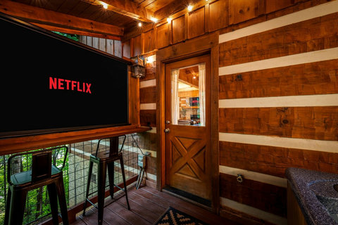 Projector by hot tub to watch your favorite movies and shows