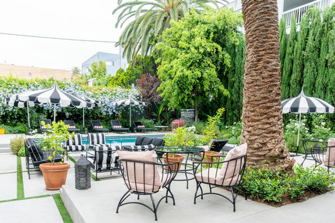 Stunning outdoor heated pool surrounded by perfectly manicured landscaping