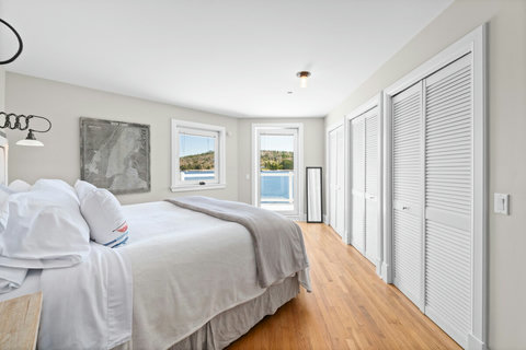 Captain's room. King feather bed, ensuite bath with soaker tub and shower.  H2O Infuse Shampoo, conditioner, body wash and lotion. 