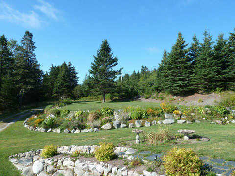Expansive front yard with fire pit.