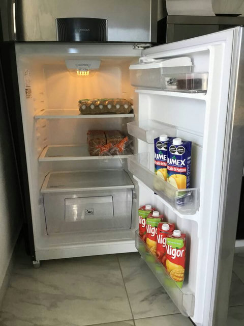 Breakfast included: eggs, bread, juice, butter,  jelly, coffee, and tea.