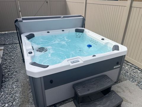 Hot tub steps from the house and pool