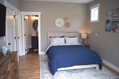Main level bedroom #2 with Queen Bed and ensuite full bath