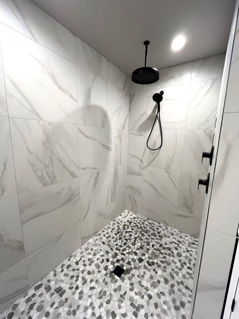 Walk-in shower in ensuite upstairs primary bedroom bathroom