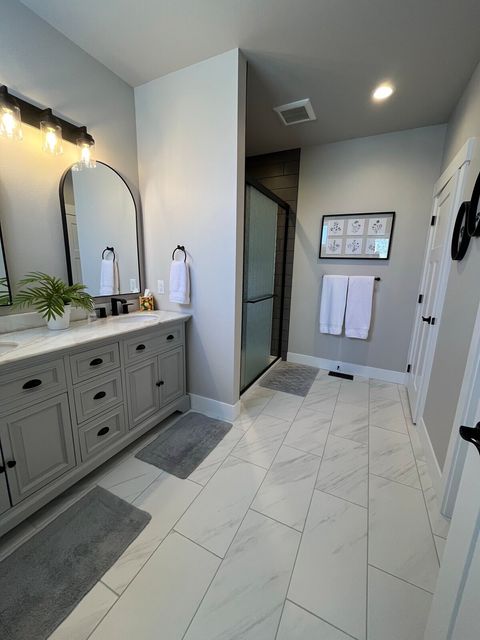 Main level bedroom #1 ensuite 3/4 bath with double vanity