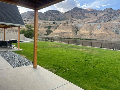 Large fenced backyard great for yard games. High bank waterfront with epic views