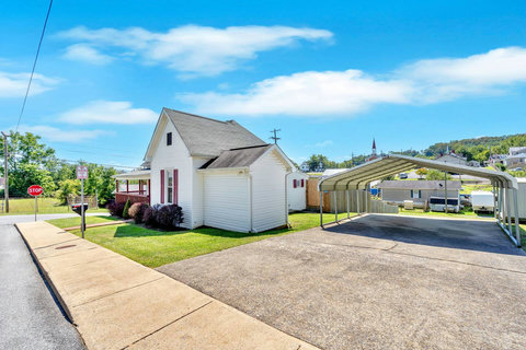 Driveway with carport for off-street parking.