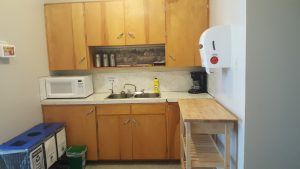 kitchen cupboards, microwave, coffee maker,  right side of the kitchen. 