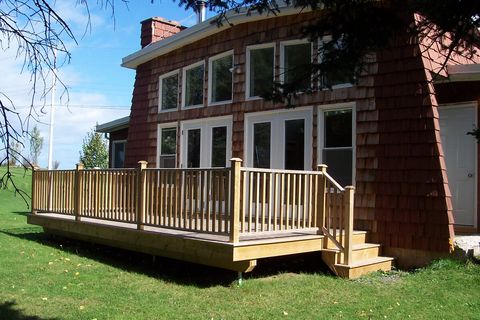 Lodge back side and deck, access to living room