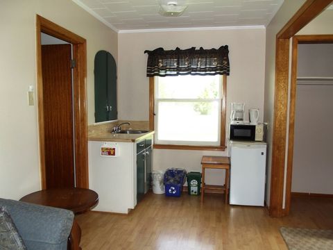 The kitchenette: fridge, microwave, coffee maker and sink