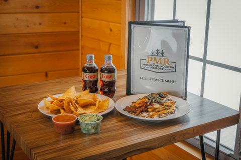 Enjoy a casual meal with chips, dips, and a main dish at presidential mountain resort's full-service dining.