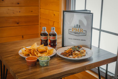 Enjoy a casual meal with chips, dips, and a main dish at presidential mountain resort's full-service dining area.