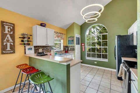 Kitchen with additional seating at the bar
