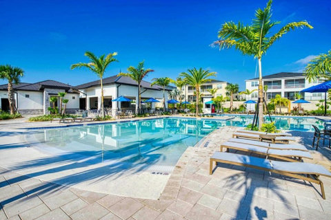 Enjoy a drink from the bar by the Oasis club pool