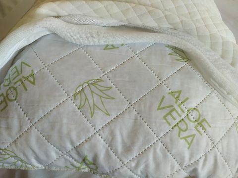 All beds have two pillows in  "memory foam"