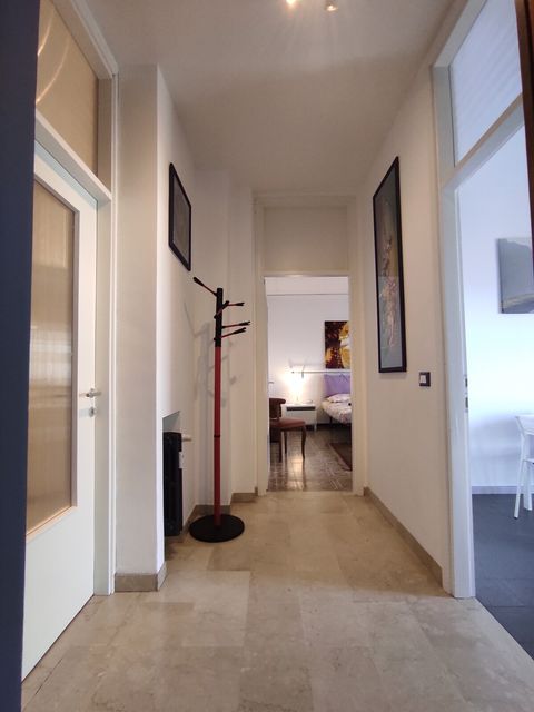 The entrance of the house, it's a small corridor that divides the kitchen from the rest of the rooms. It goes directly to a double bedroom , to the kitchen on the right door.