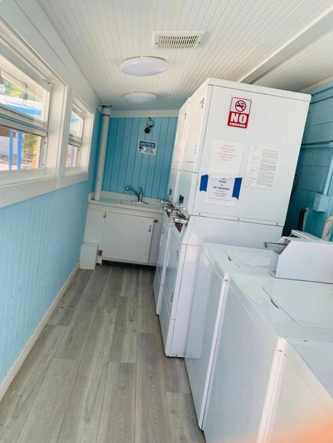 Coin operated laundry room. Open 24 hours. $2.00/wash & $2.00 to dry. 