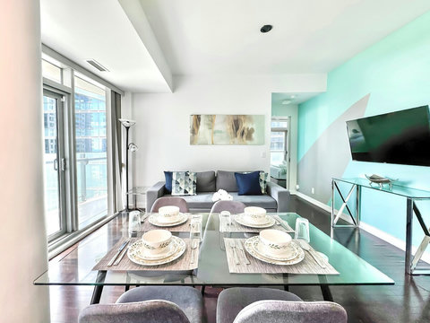 Enjoy meals together in a cozy dining area that comfortably seats four. Whether it’s a quick breakfast or a relaxed dinner, this space is perfect for sharing food, laughter, and great conversations with a stunning city backdrop.