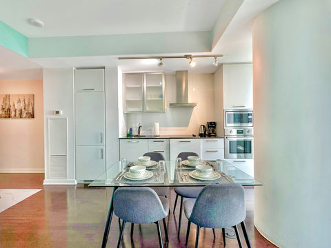 Enjoy meals together in a cozy dining area that comfortably seats four. Whether it’s a quick breakfast or a relaxed dinner, this space is perfect for sharing food, laughter, and great conversations with a stunning city backdrop.