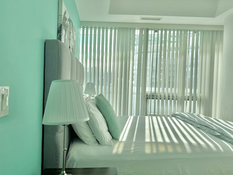 The second bedroom offers a cozy and comfortable space with a plush queen-size bed and soft linens. Perfect for a restful night’s sleep, this room is ideal for guests seeking a quiet and relaxing retreat after a busy day in the city.