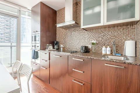 Cook Like Home – Fully Equipped Kitchen with Ceramic Pans - 
Whip up meals with ease in this modern kitchen stocked with ceramic non-stick pans, full-size appliances, and all the essentials.