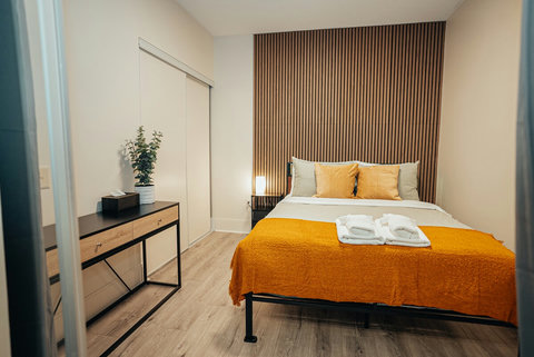 This bedroom offers ample closet space and storage for a comfortable stay