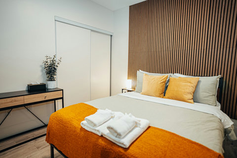 This bedroom offers ample closet space and storage for a comfortable stay