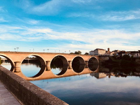 The old bridge at Bergerac reflected in La Dordogne. Well worth taking a boat ride from here!