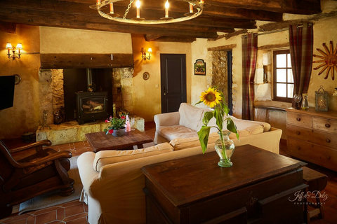 Movies or a cosy fire in the Salon. Behind is a dining table that seats 8