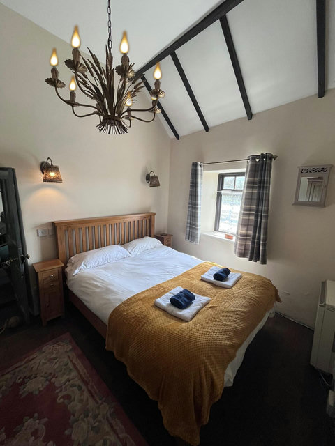 Double bedroom with a view up Eilian Mountain