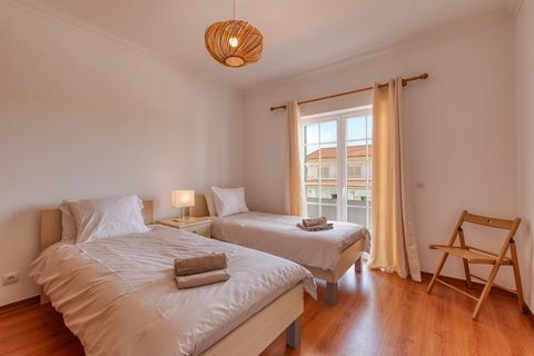 Two single beds and access to the balcony
