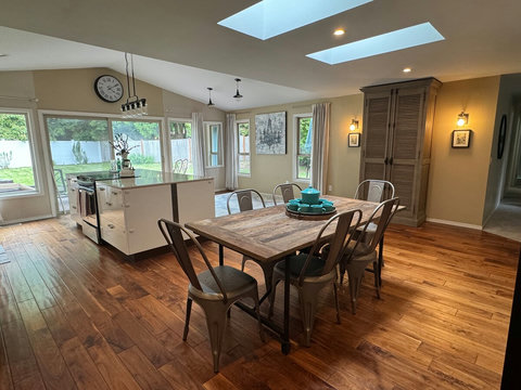 Kitchen & Dining: Spacious design with natural light, modern finishes, and a delightful large backyard view!