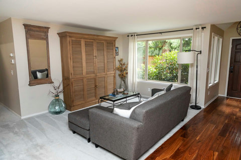 Living Room: Bright and inviting space with relaxed seating and views of lush greenery!