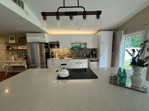 Kitchen: Bright and modern space perfect for culinary adventures and entertaining!