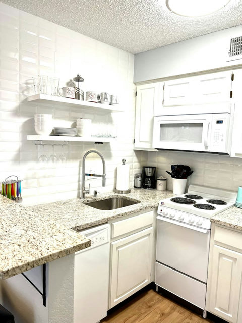 Sleek Simplicity: Experience Modern Charm in this Efficiently Designed Kitchen