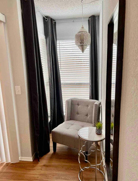 Cozy Reading Nook: Find Solace and Inspiration in the Charming Reading Corner with Abundant Natural Light