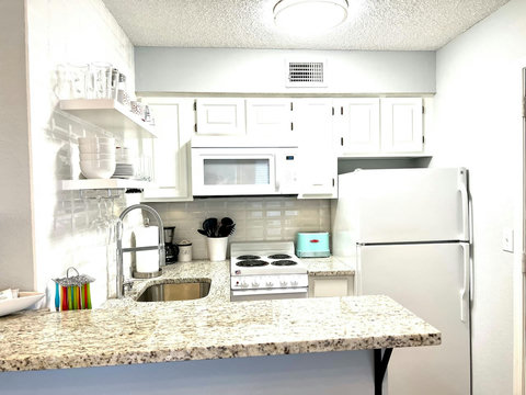 Sleek Simplicity: Experience Modern Charm in this Efficiently Designed Kitchen