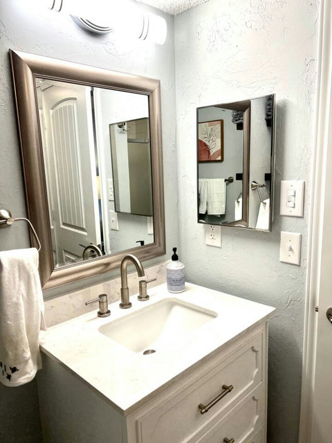 Pure Tranquility: Immerse Yourself in Refreshing Luxury with a Spotlessly Clean Bathroom and Invigorating Stand-Up Shower