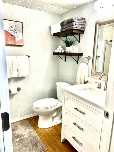 Pure Tranquility: Immerse Yourself in Refreshing Luxury with a Spotlessly Clean Bathroom and Invigorating Stand-Up Shower