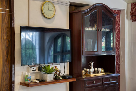 Living Room equipped with 55inch Television.