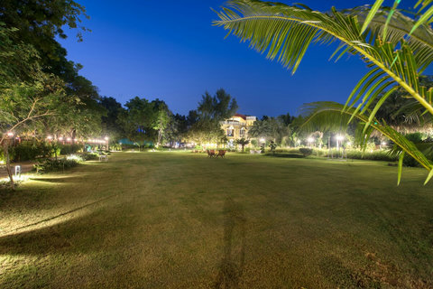 Evening view of lawn and villa