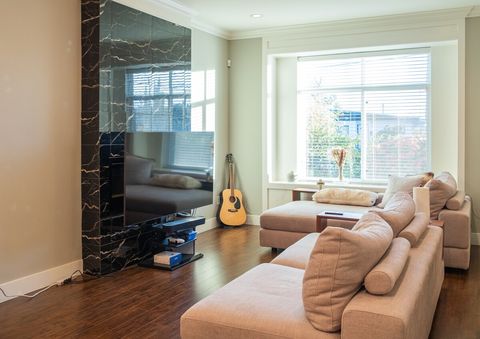 Living room with is bright and sunny.  Smart TV comes with access to Netflix, Disney+, Amazon Prime, PS 5, guitar, and upright piano.   